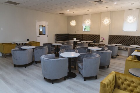 a room filled with furniture and a sink