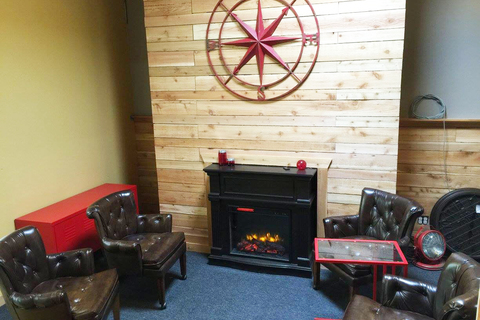 a living room filled with furniture and a fire place