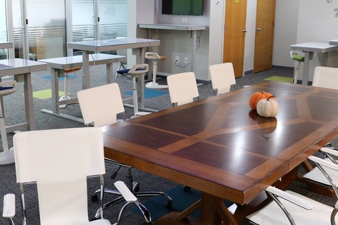 a desk with a computer on a table