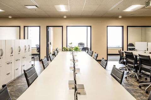 a room filled with furniture and a large window