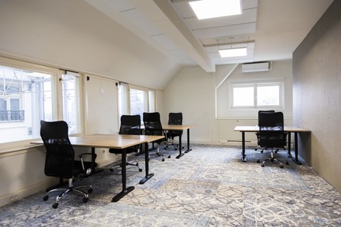a room filled with furniture and a large window