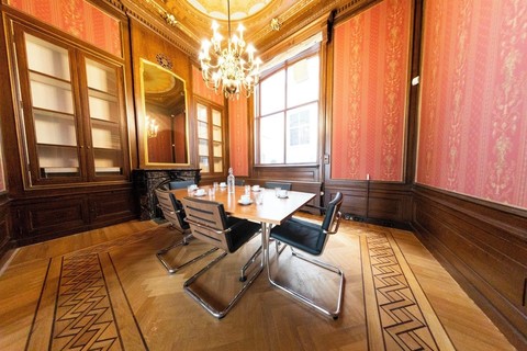 a room filled with furniture and a large window