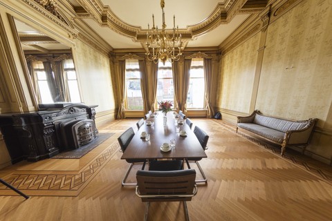 a living room filled with furniture and a large window