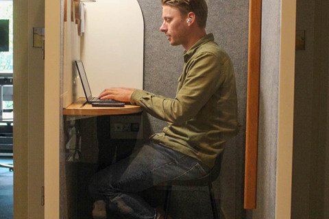 a man standing in front of a mirror posing for the camera