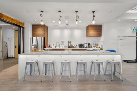 a kitchen with a table in a room