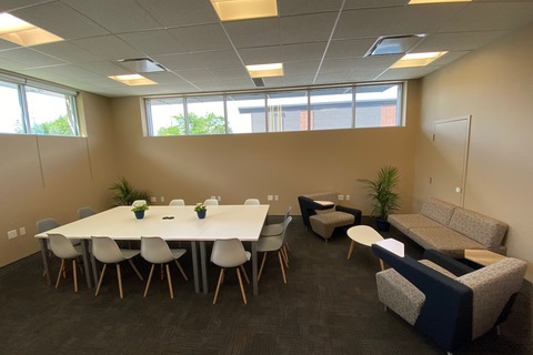 a room filled with furniture and a large window