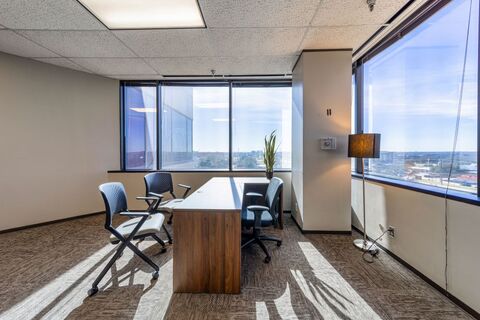 a room filled with furniture and a large window