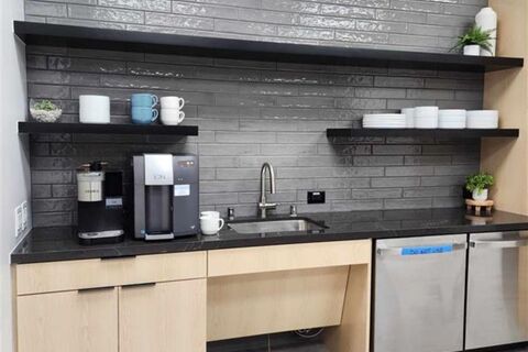a large kitchen with stainless steel appliances