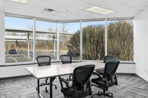 a room with a table and chairs