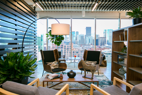 a room with a large window and a city view