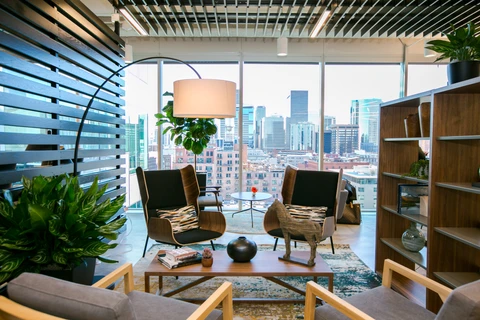 a room with a large window and a city view