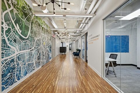 a long hallway with a map on the wall