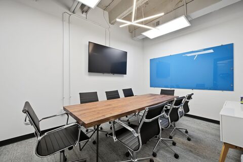 a room with a table and chairs