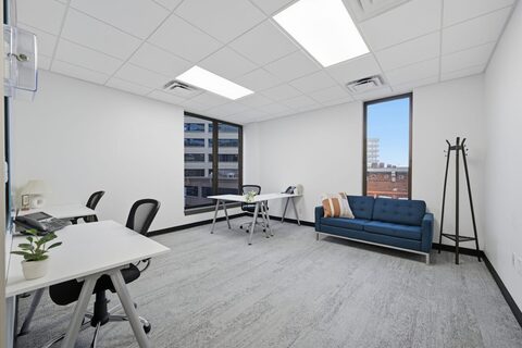 a room with a couch and tables
