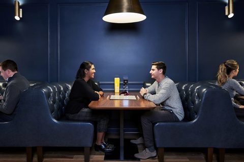 a group of people sitting at a table