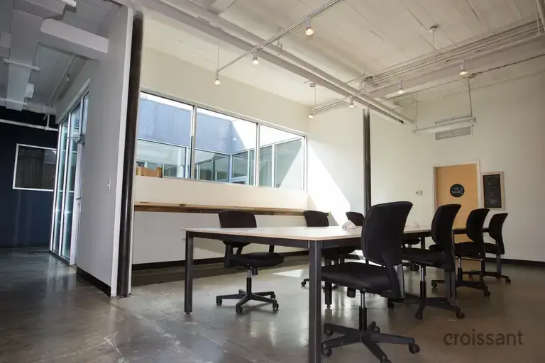 a room with a table and chairs