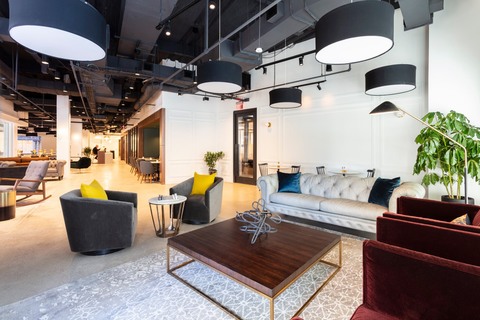 a living room filled with furniture and a table