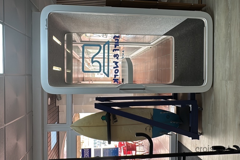 a surfboard in a glass booth