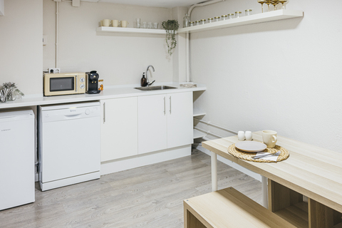 a kitchen with a sink and a mirror