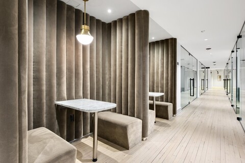 a bedroom with a bed and a chair in a room
