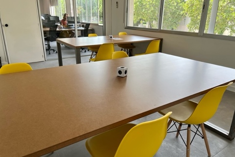 a dining room table in front of a window
