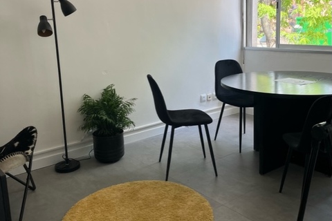 a room filled with furniture and a large window