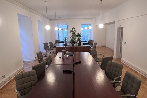 a conference room with a table and chairs