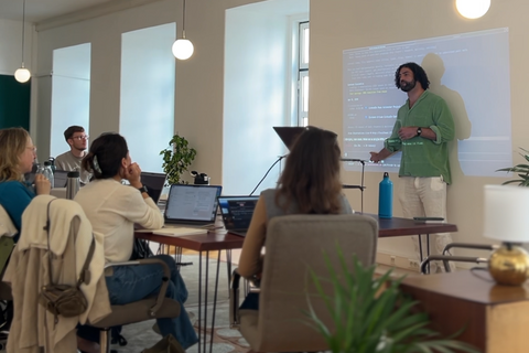 a man standing in front of a screen