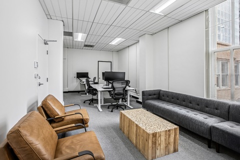 a living room filled with furniture and a table