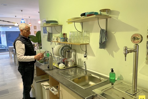 a man standing in a kitchen