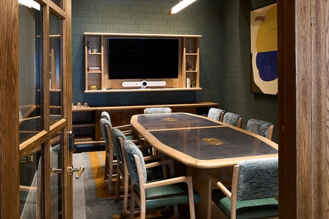 a desk with a chair in a room