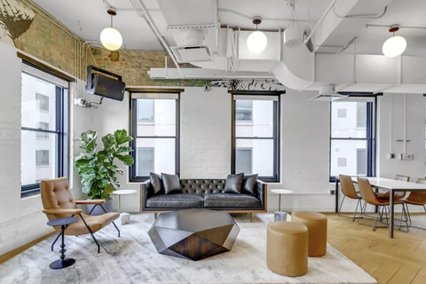 a room filled with furniture and a fireplace