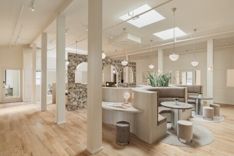 a room filled with furniture and a large mirror