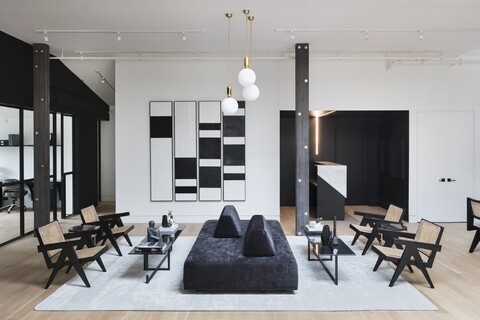 a living room filled with furniture and a fireplace