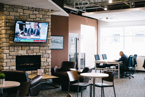 a living room filled with furniture and a flat screen tv