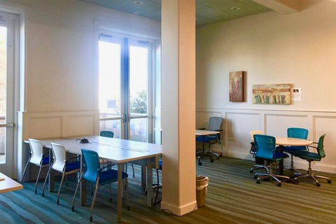 a room filled with furniture and a large window