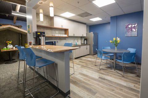 a kitchen with a table in a room