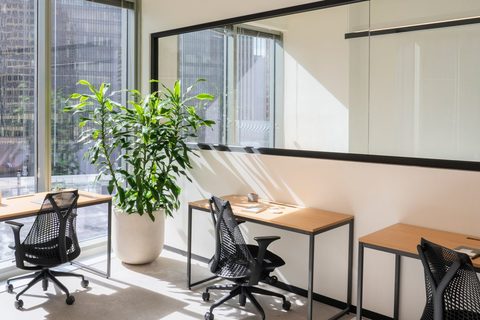 a dining room table in front of a window