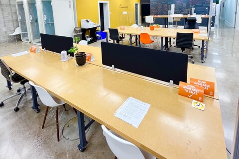 a desk with a computer on a table