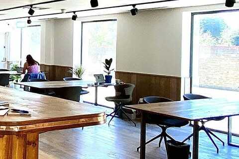 a room filled with furniture and a large window