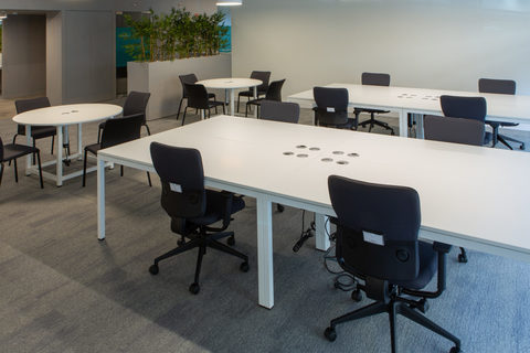 an office with a desk and chair in a room