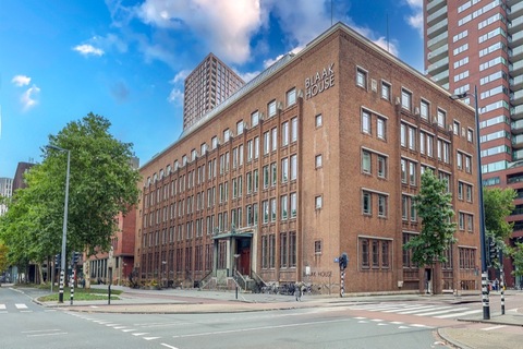 a tall building in the middle of the street