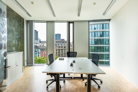 a room filled with furniture and a large window