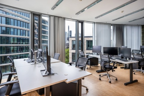 a room filled with furniture and a large window
