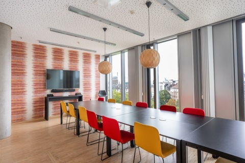 a dining room table in front of a window