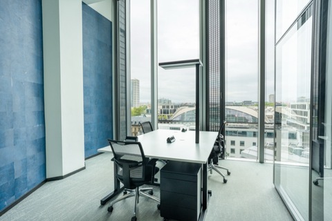 a room filled with furniture and a large window