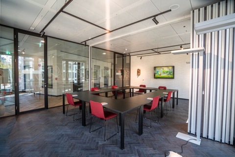 a large room with tables and chairs