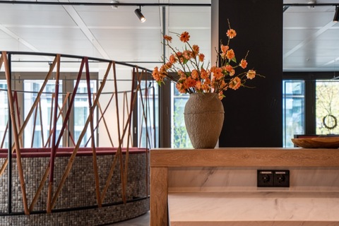 a vase of flowers on a table