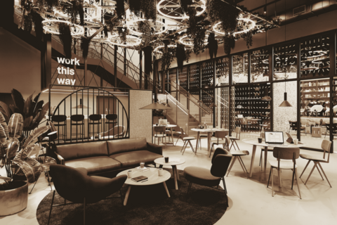 a room filled with furniture and a table in front of a building