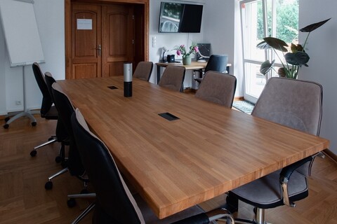 a room with a table and chairs